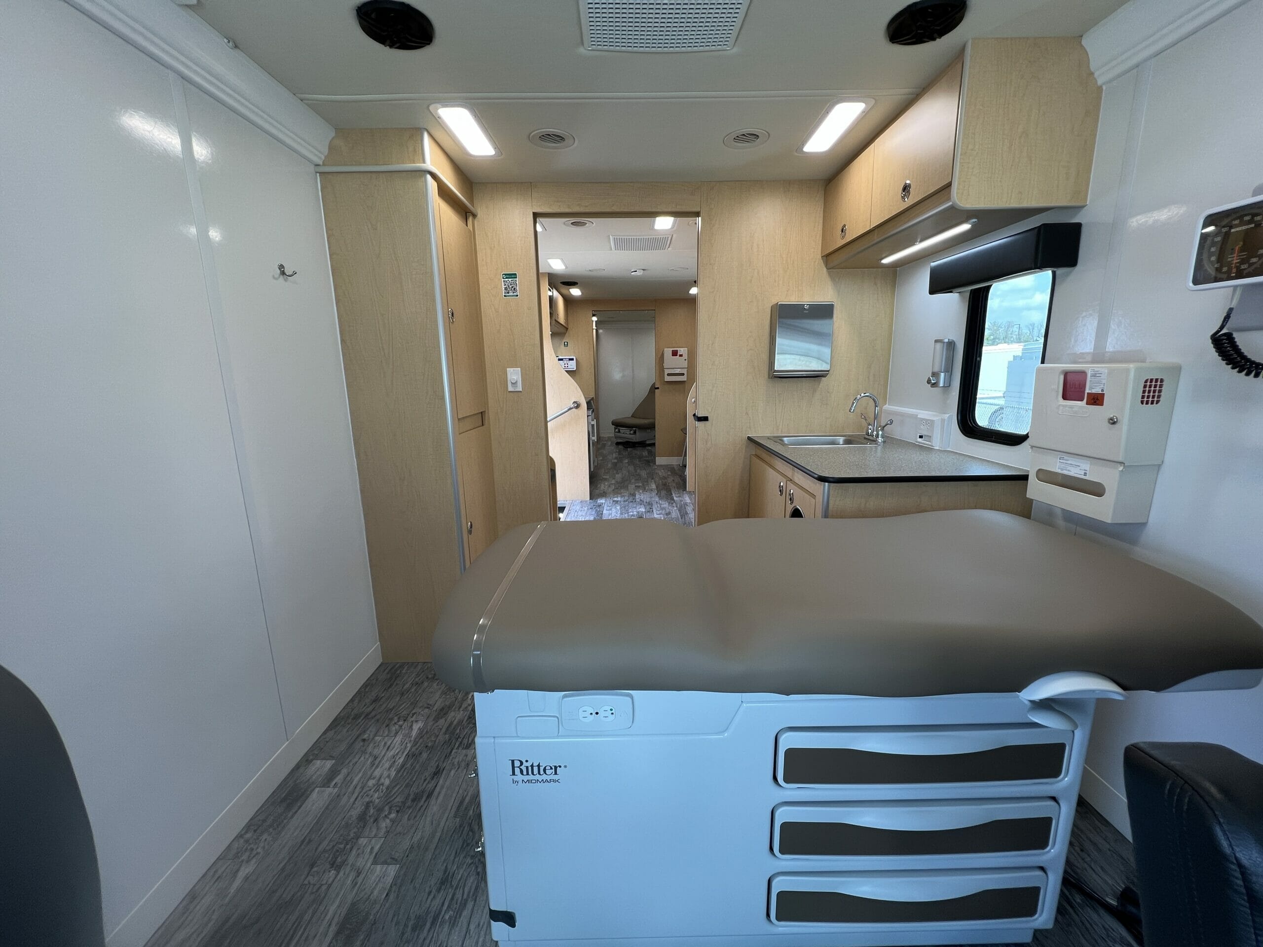 well med mobile clinic interior - summit bodyworks feature build